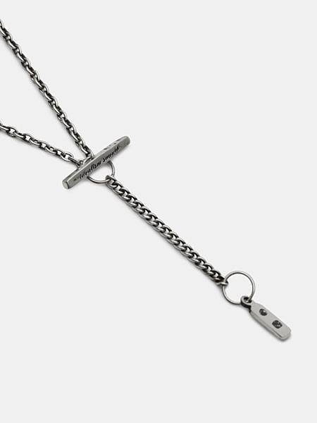 オリジナルのTバーマンテルとアジャスター、刻印入りプレートタグが確認できるチェーンエンドの画像。