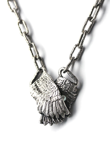 CLUTCHING WING NECKLACE